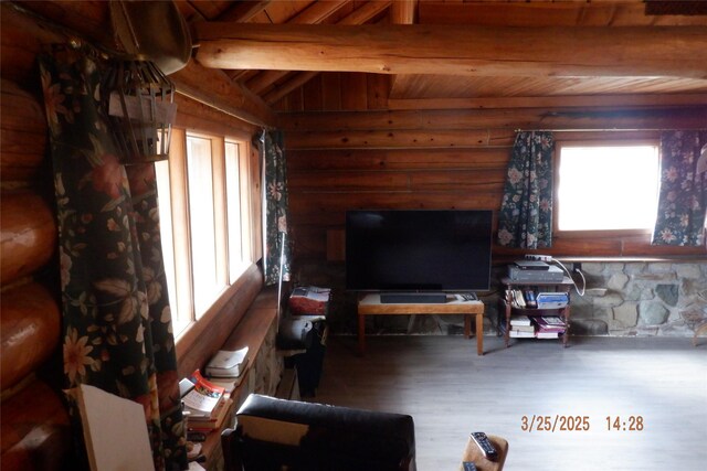 18522 Geiger Ln, Proctor, MT 59929 - living area with wood ceiling, wood finished floors, and rustic walls
