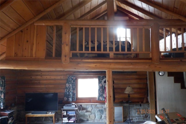 18522 Geiger Ln, Proctor, MT 59929 - living room with vaulted ceiling, rustic walls, and wooden ceiling