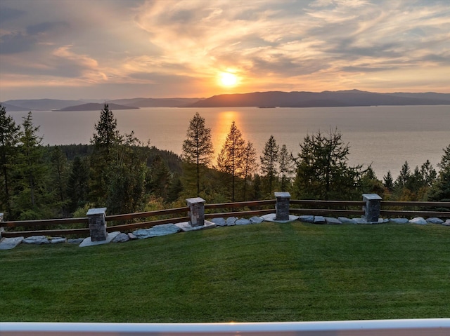 31572 Lake To Sky Dr, Bigfork, MT 59911 - view of green lawn featuring a water and mountain view