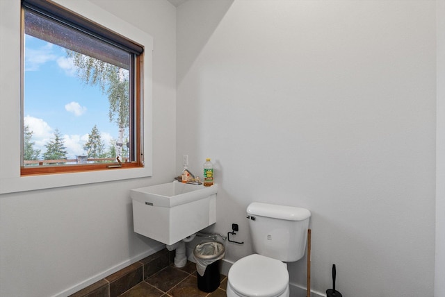 31572 Lake To Sky Dr, Bigfork, MT 59911 - half bath featuring toilet and baseboards