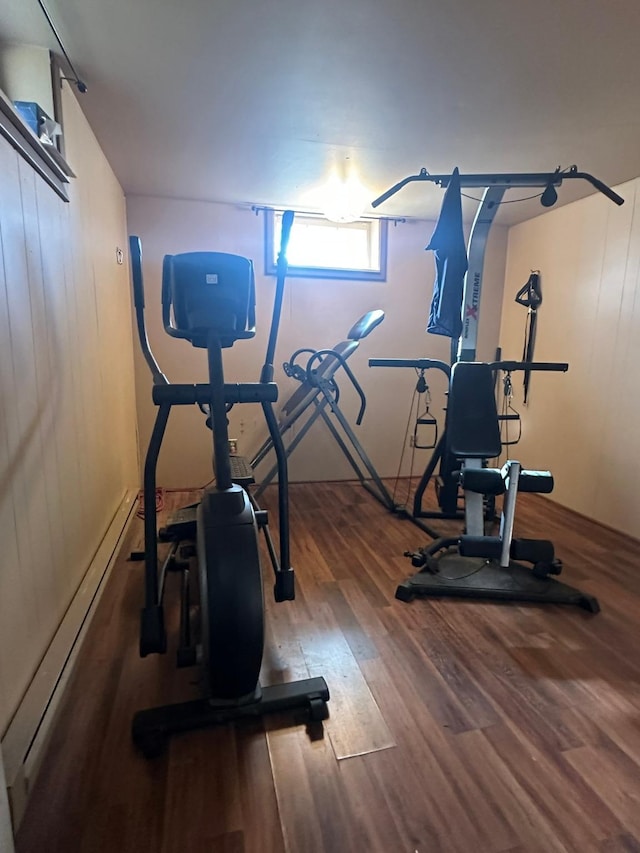 815 3rd Ave E, Kalispell, MT 59901 - exercise area with wood finished floors and a baseboard heating unit