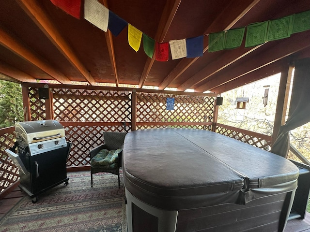 815 3rd Ave E, Kalispell, MT 59901 - deck with a hot tub and a grill