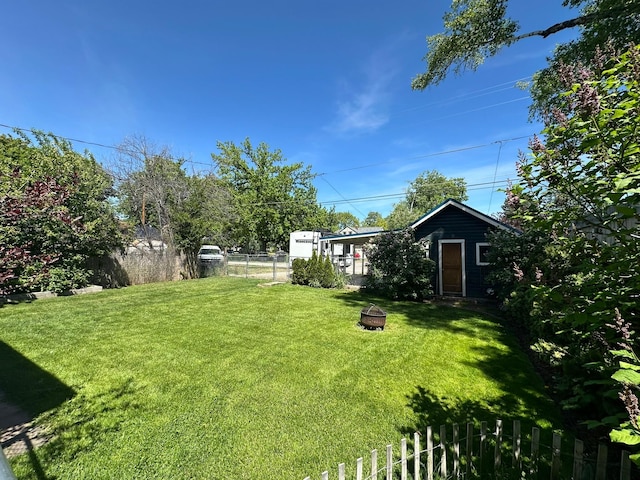 815 3rd Ave E, Kalispell, MT 59901 - view of yard with an outdoor fire pit