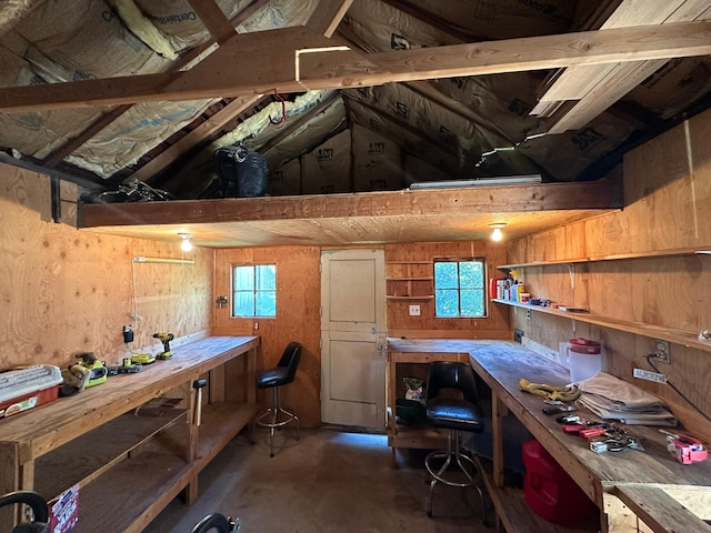 815 3rd Ave E, Kalispell, MT 59901 - office featuring a workshop area, wooden walls, and concrete flooring