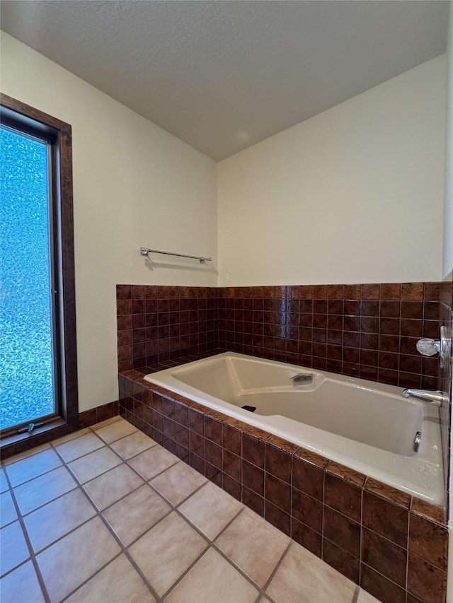 306 Parker Lakes Rd, Bigfork, MT 59911 - bathroom featuring a garden tub and tile patterned floors