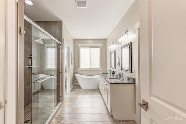 2883 Alpine View Loop, Helena, MT 59601 - full bathroom featuring a stall shower, a freestanding bath, vanity, and recessed lighting