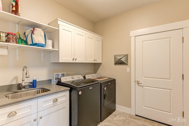 2883 Alpine View Loop, Helena, MT 59601 - laundry area featuring washing machine and clothes dryer, cabinet space, and baseboards