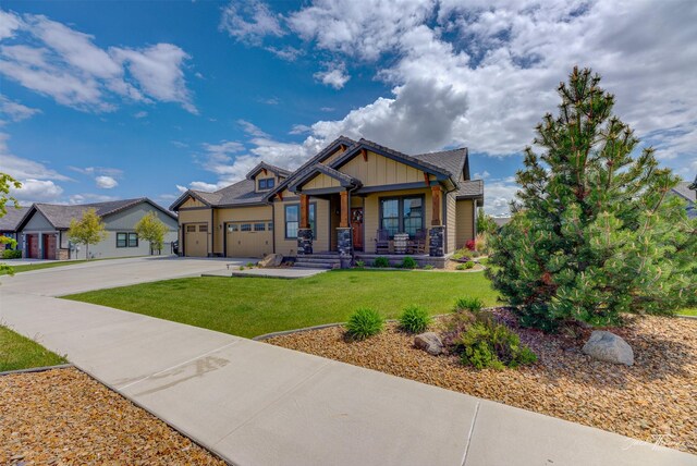2883 Alpine View Loop, Helena, MT 59601 - craftsman-style home featuring board and batten siding, a porch, concrete driveway, a garage, and a front lawn
