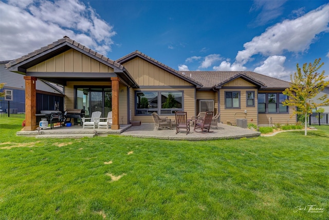 2883 Alpine View Loop, Helena, MT 59601 - rear view of house featuring a tiled roof and a patio area