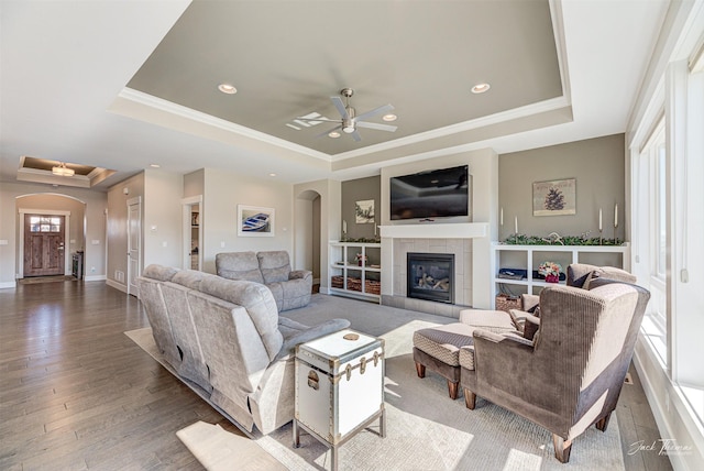 2883 Alpine View Loop, Helena, MT 59601 - living area featuring a tray ceiling, arched walkways, ceiling fan, crown molding, and recessed lighting