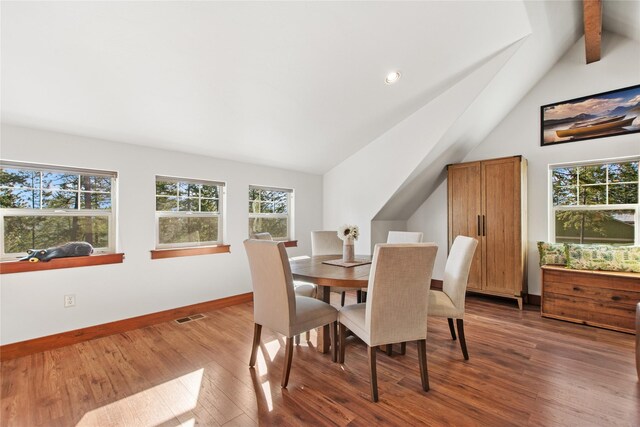 255 Windsor Ct, Bigfork, MT 59911 - dining area featuring plenty of natural light, wood finished floors, and baseboards