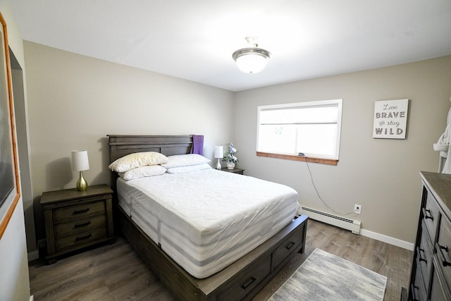 3406 4th Ave S, Great Falls, MT 59405 - bedroom with a baseboard heating unit and dark wood-style floors