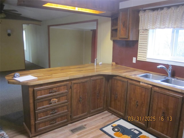 4612 Richlie St, Missoula, MT 59808 - kitchen featuring a peninsula, light wood-style floors, and ceiling fan