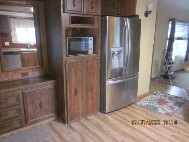 4612 Richlie St, Missoula, MT 59808 - kitchen featuring stainless steel refrigerator with ice dispenser and light wood-type flooring