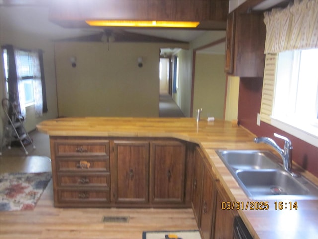 4612 Richlie St, Missoula, MT 59808 - kitchen with wood counters, a peninsula, and light wood-style flooring