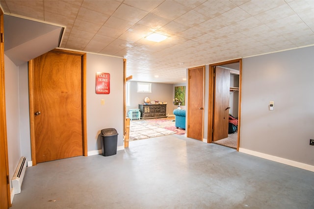 interior space featuring baseboards and a baseboard radiator