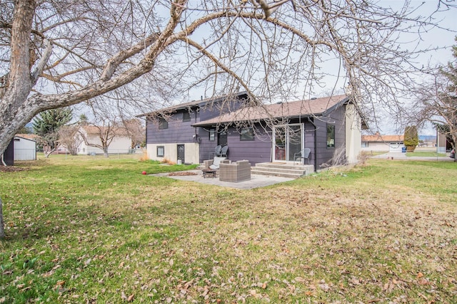 back of property featuring a lawn, entry steps, and a patio area