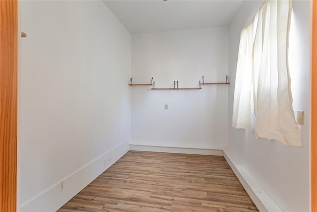 spare room with wood finished floors