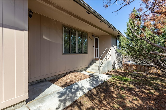 doorway to property with fence