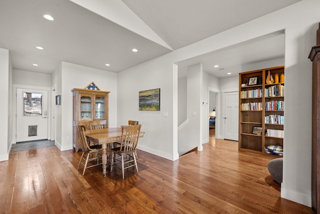 304 Stumptown Loop, Whitefish, MT 59937 - dining area with hardwood / wood-style flooring, recessed lighting, and vaulted ceiling