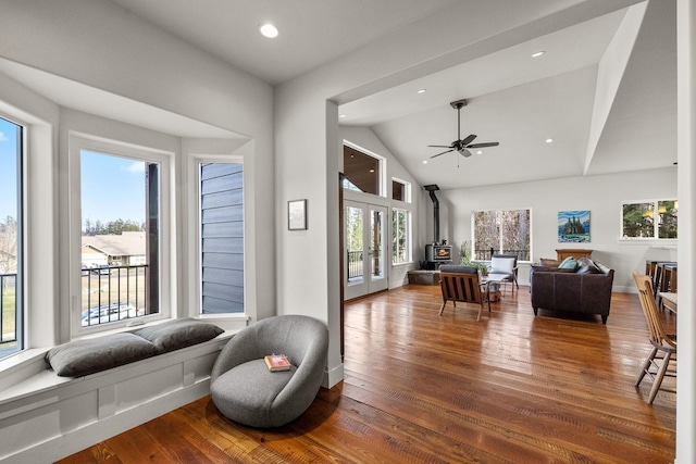 304 Stumptown Loop, Whitefish, MT 59937 - living room with a wood stove, wood finished floors, ceiling fan, recessed lighting, and high vaulted ceiling