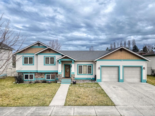 425 Northridge Dr, Kalispell, MT 59901 - split level home with a garage, a front yard, and concrete driveway
