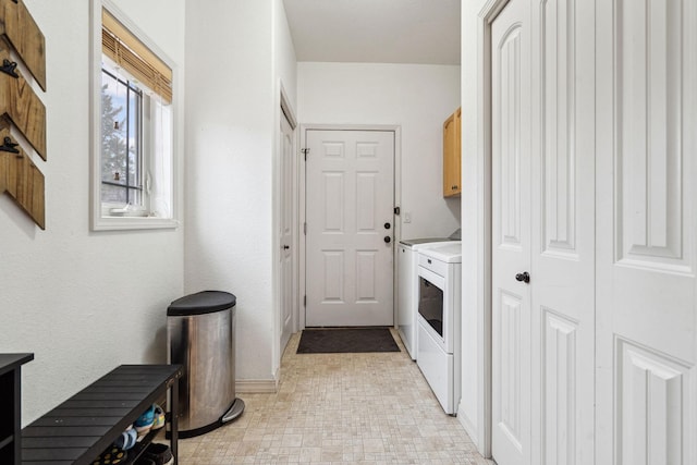 425 Northridge Dr, Kalispell, MT 59901 - clothes washing area featuring washing machine and dryer, light floors, and cabinet space