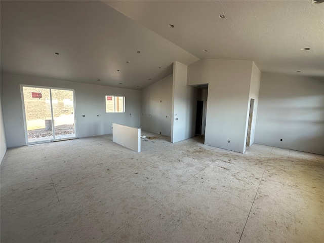 spare room featuring vaulted ceiling