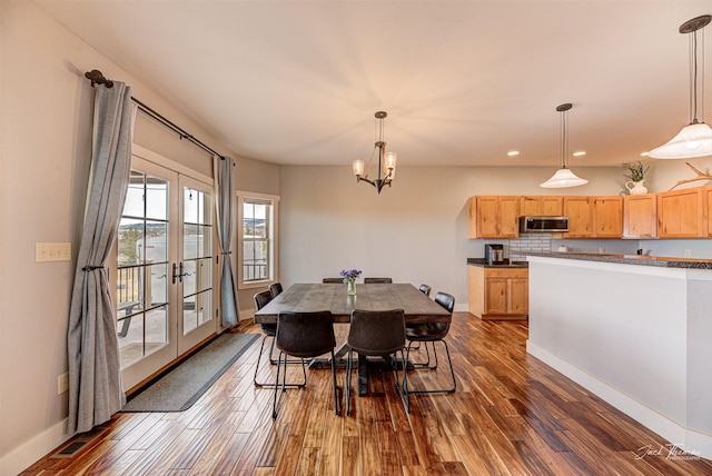 2160 Crested Wheat Loop, East Helena, MT 59635 - dining room featuring a chandelier, dark wood-type flooring, french doors, and baseboards