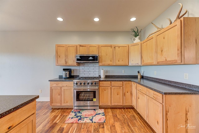 2160 Crested Wheat Loop, East Helena, MT 59635 - kitchen with light wood-style flooring, light brown cabinetry, and stainless steel appliances
