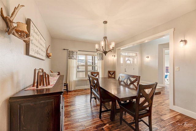 2160 Crested Wheat Loop, East Helena, MT 59635 - dining space with dark wood-type flooring, a notable chandelier, and baseboards