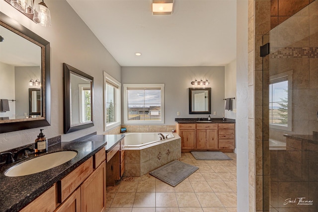 2160 Crested Wheat Loop, East Helena, MT 59635 - bathroom featuring tile patterned floors, tiled shower, a bath, and a sink