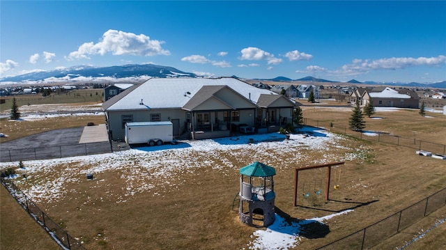2160 Crested Wheat Loop, East Helena, MT 59635 - exterior space with a mountain view, a fenced backyard, and a sunroom
