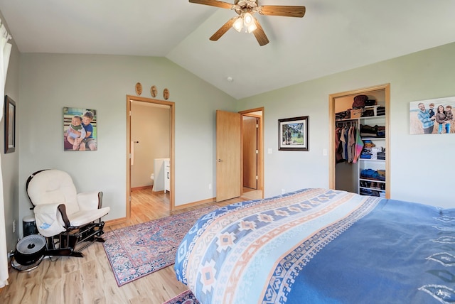24 Spruce Grove Rd, East Helena, MT 59635 - bedroom with light wood finished floors, vaulted ceiling, a spacious closet, a closet, and a ceiling fan