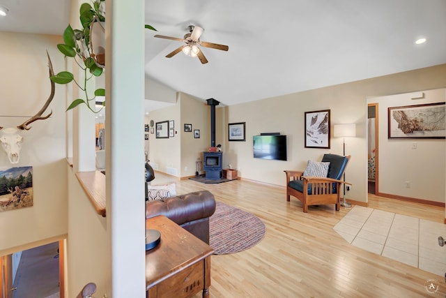 24 Spruce Grove Rd, East Helena, MT 59635 - living area with a wood stove, ceiling fan, wood finished floors, recessed lighting, and vaulted ceiling