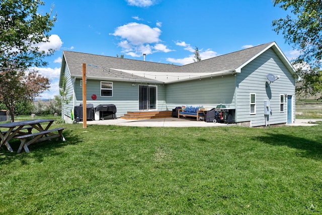 24 Spruce Grove Rd, East Helena, MT 59635 - rear view of property with a patio area, a lawn, roof with shingles, and outdoor lounge area