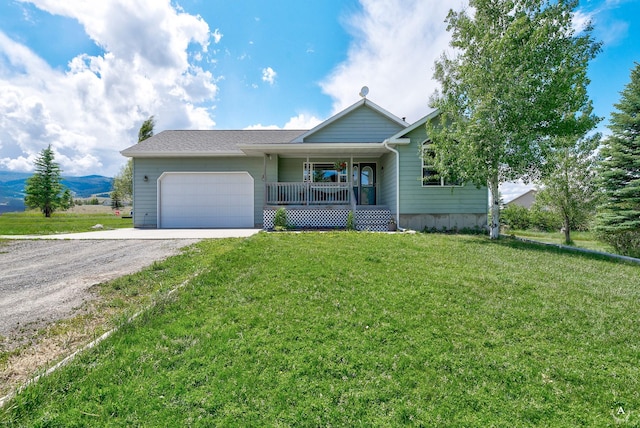 24 Spruce Grove Rd, East Helena, MT 59635 - ranch-style home featuring covered porch, dirt driveway, a garage, a front yard, and a mountain view