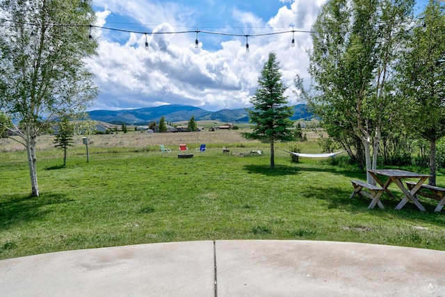 24 Spruce Grove Rd, East Helena, MT 59635 - view of green lawn with a mountain view and a view of countryside