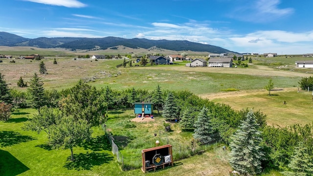 24 Spruce Grove Rd, East Helena, MT 59635 - aerial view of sparsely populated area with a mountain backdrop