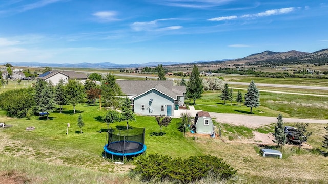 24 Spruce Grove Rd, East Helena, MT 59635 - aerial view of property and surrounding area featuring a mountainous background