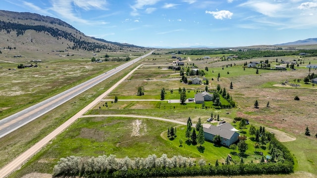 24 Spruce Grove Rd, East Helena, MT 59635 - overview of rural landscape featuring a mountainous background