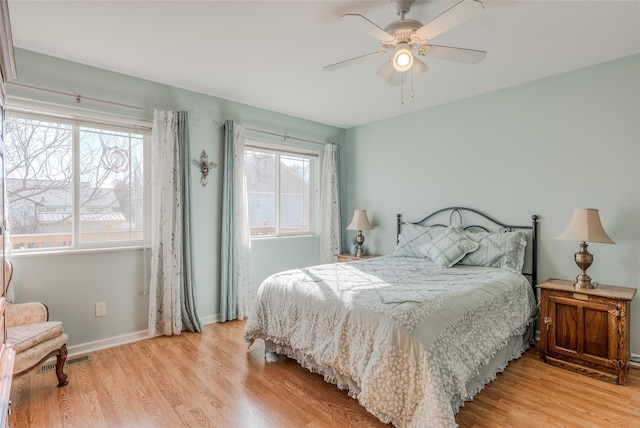 675 Pebble Dr, Kalispell, MT 59901 - bedroom with light wood finished floors and a ceiling fan