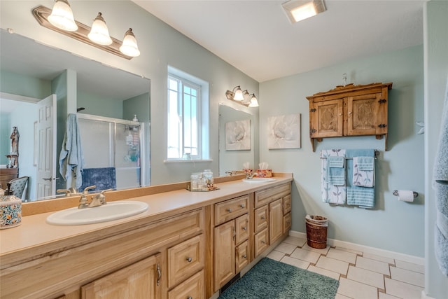 675 Pebble Dr, Kalispell, MT 59901 - full bath with a shower stall, double vanity, and tile patterned flooring