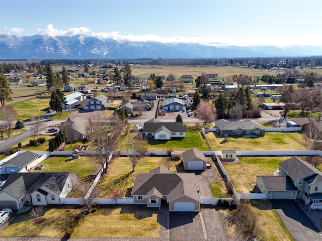 675 Pebble Dr, Kalispell, MT 59901 - aerial view of residential area featuring a mountainous background