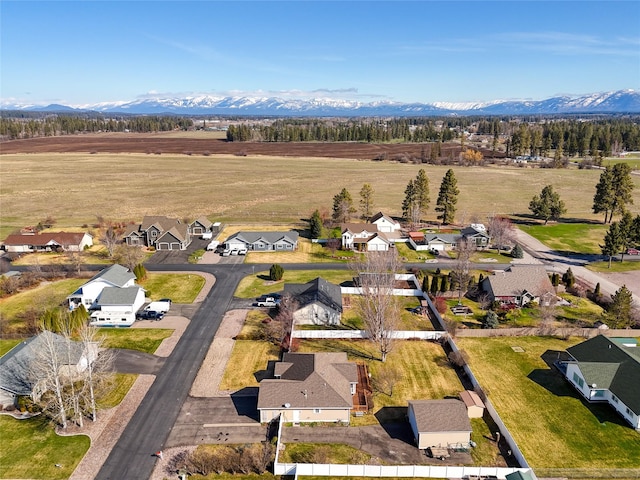 675 Pebble Dr, Kalispell, MT 59901 - aerial perspective of suburban area featuring a mountainous background