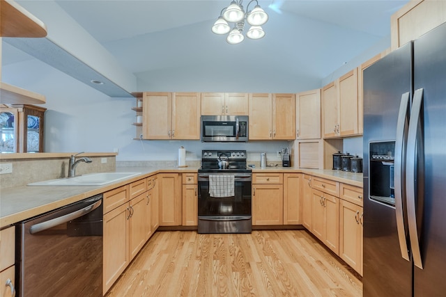 675 Pebble Dr, Kalispell, MT 59901 - kitchen with appliances with stainless steel finishes, light brown cabinetry, light wood finished floors, light countertops, and open shelves