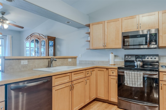 675 Pebble Dr, Kalispell, MT 59901 - kitchen featuring stainless steel appliances, light brown cabinets, light countertops, light wood-type flooring, and ceiling fan
