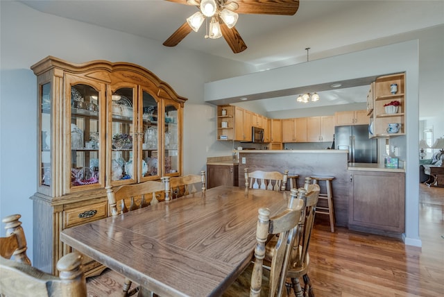 675 Pebble Dr, Kalispell, MT 59901 - dining space featuring a ceiling fan, light wood-type flooring, and a chandelier
