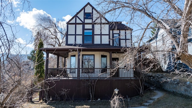 521 Clarke St, Helena, MT 59601 - view of front of house with covered porch, roof with shingles, and stucco siding