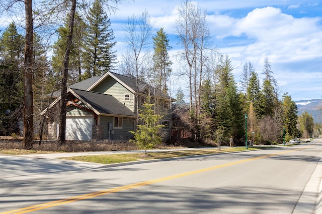 100 Forest Ridge Dr Unit B, Whitefish, MT 59937 - view of asphalt road featuring sidewalks
